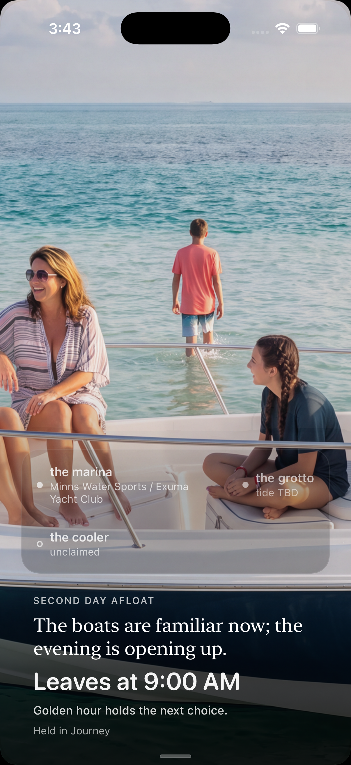 VacationOS Boat Day Two afternoon: the family relaxed on the bow of the Whaler in shallow aqua water.