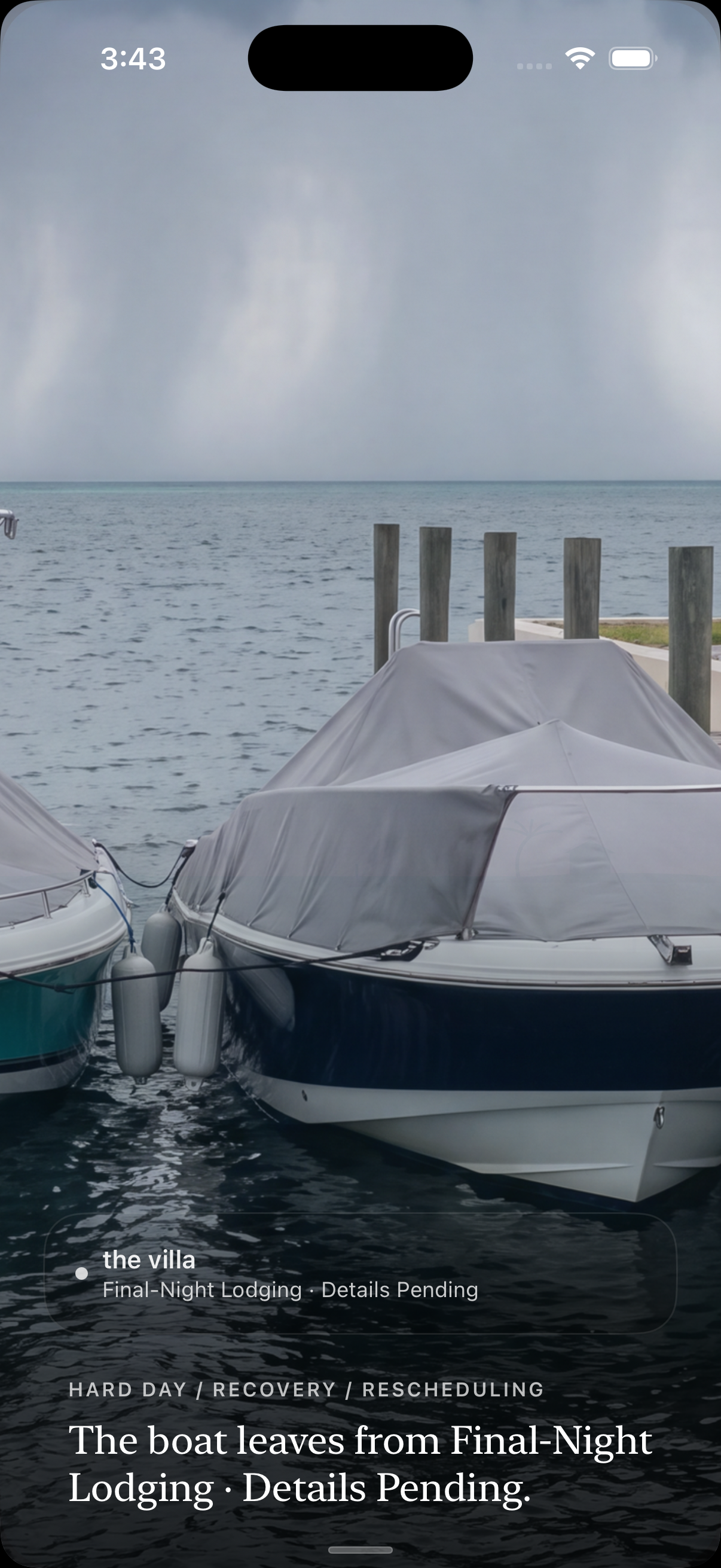 VacationOS: both boats tied and covered at the dock while rain moves across the water.